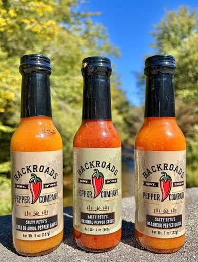 Salty Pete's Hot Sauce Trio displayed outdoors