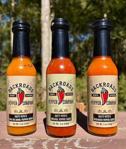 Salty Pete's Chili de Arbol, Original and Habanero Pepper Sauce bottles