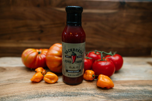 Backroads Habanero Ketchup bottle with tomatoes and fresh peppers